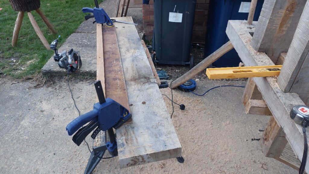 Pole-lathe bed with saw sledge and clamps